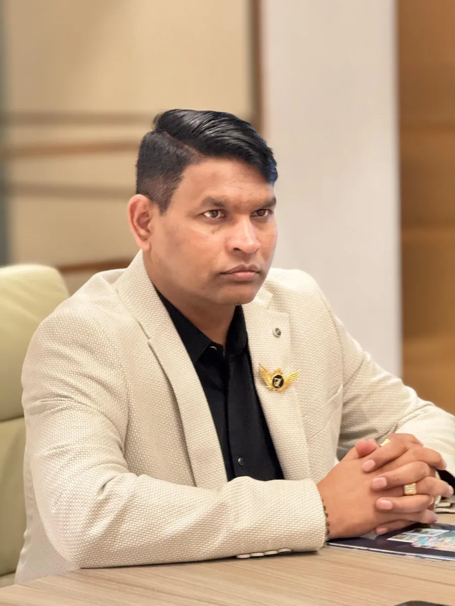 Dr. Rajendra Upadhye seated at his desk
