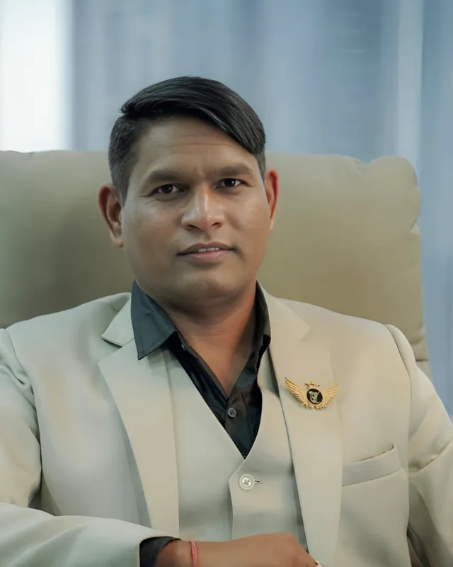 Portrait of Dr. Rajendra Upadhye in a cream blazer