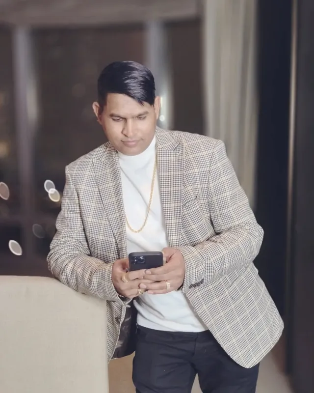 Dr. Rajendra Upadhye in a checked blazer