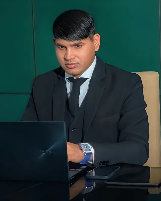 Dr. Rajendra Upadhye working at a laptop